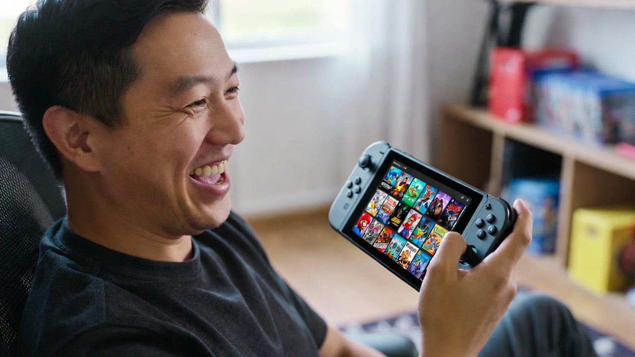 Gamer holding Nintendo Switch 2 with game library on screen